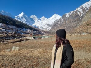 a girl watching panchachauli peaks